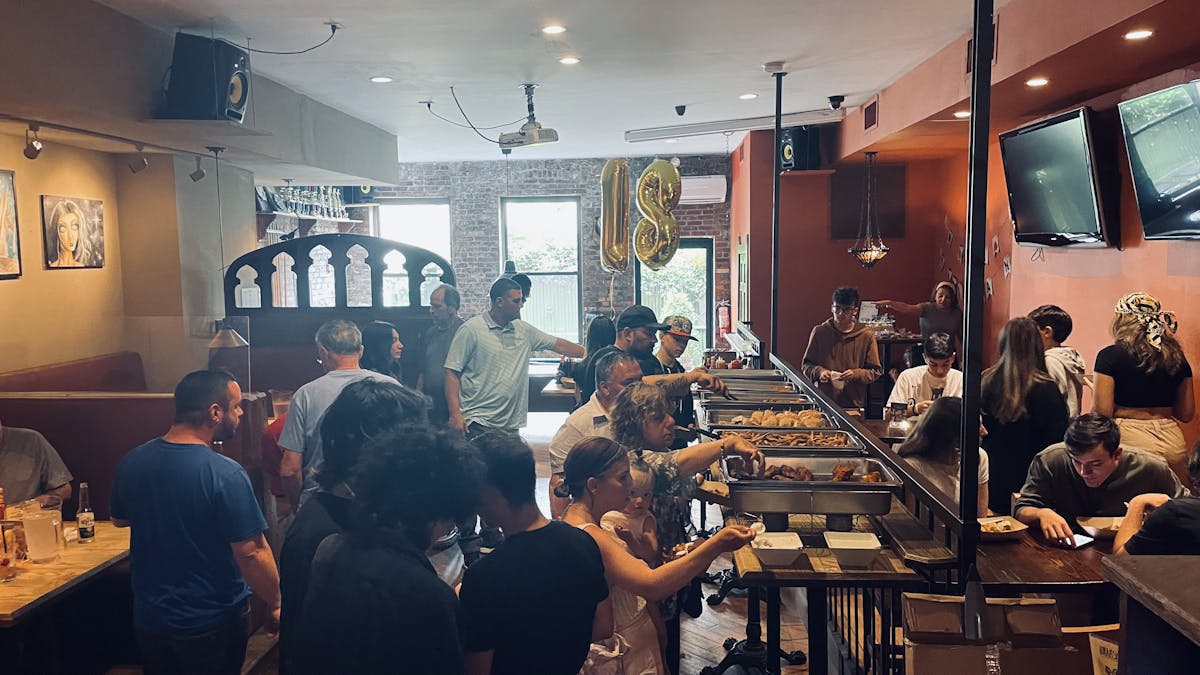 a group of people playing instruments and performing on a counter