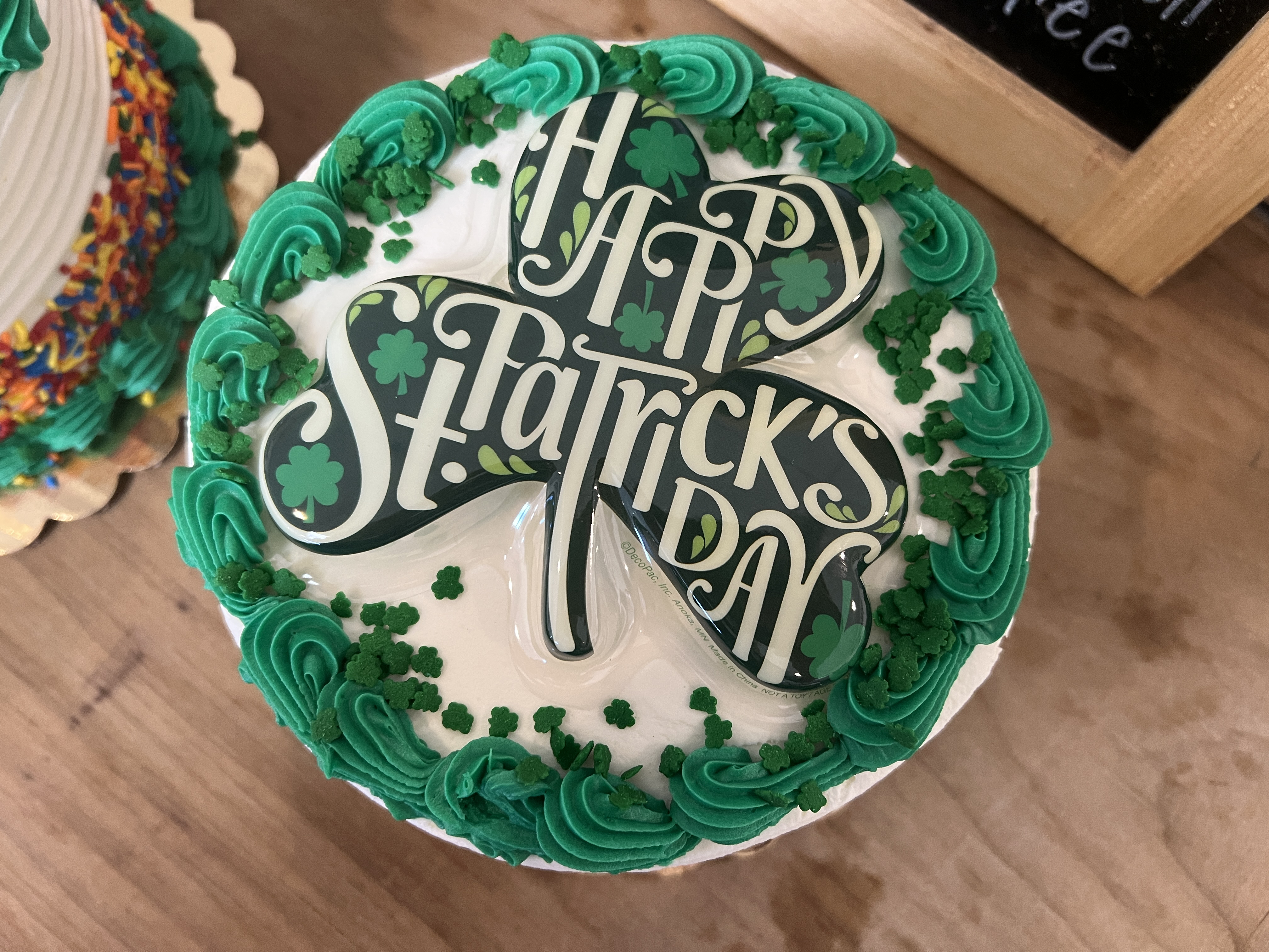 a cake sitting on top of a wooden table