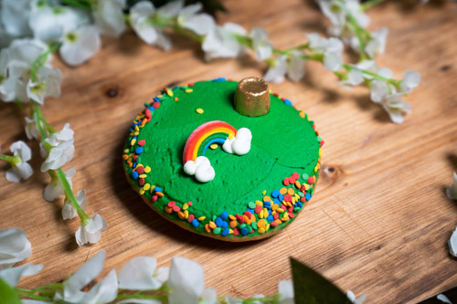 a piece of cake sitting on top of a wooden cutting board