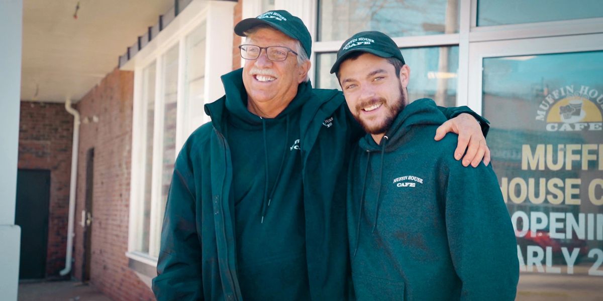a man standing in front of a building