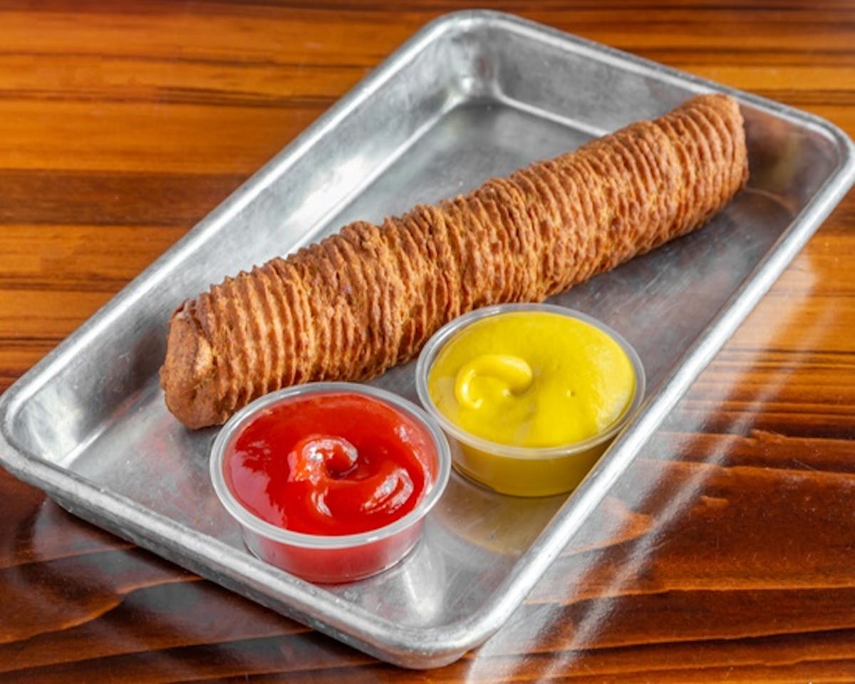 a churro hotdog on a tray