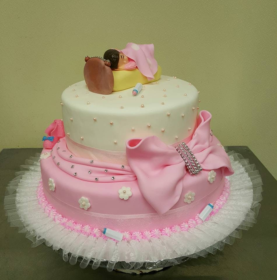 a pink birthday cake