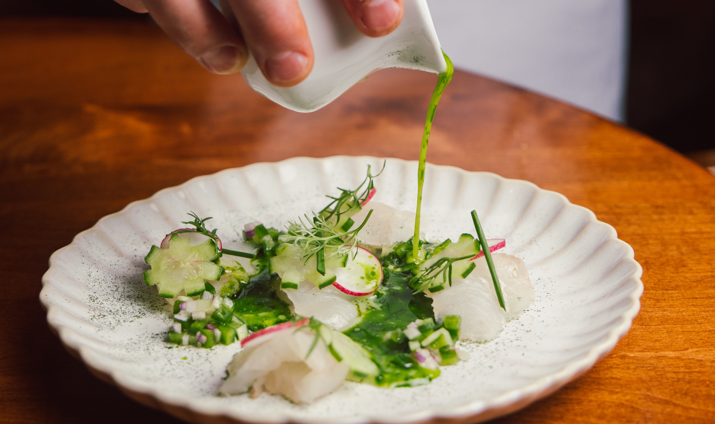 a plate of food sitting on top of a wooden table