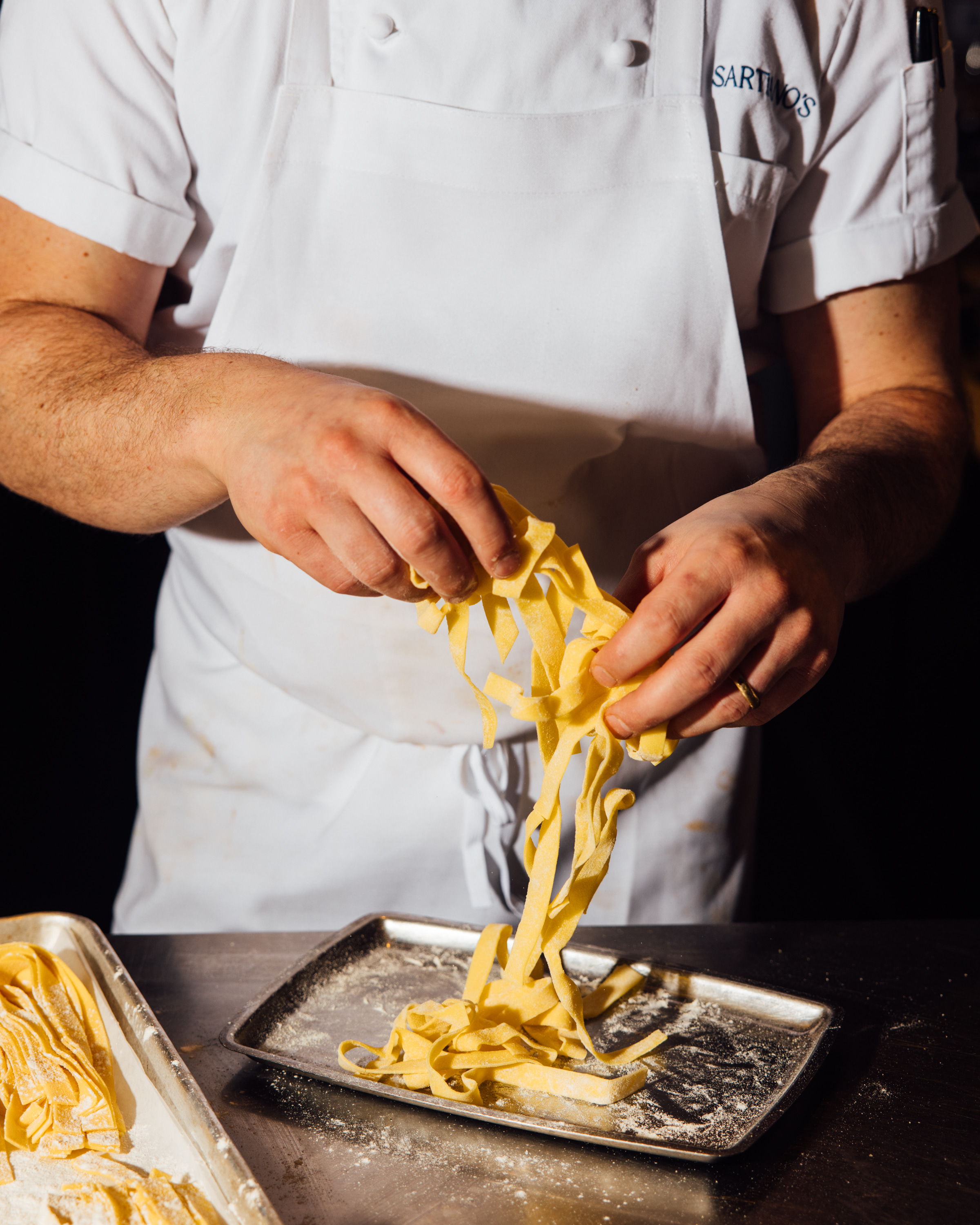 a man cutting food on a table