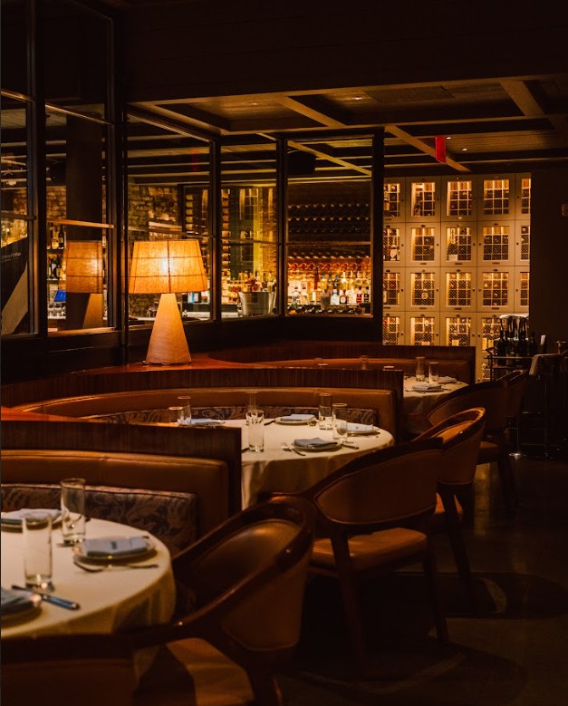 a room filled with furniture and a large window