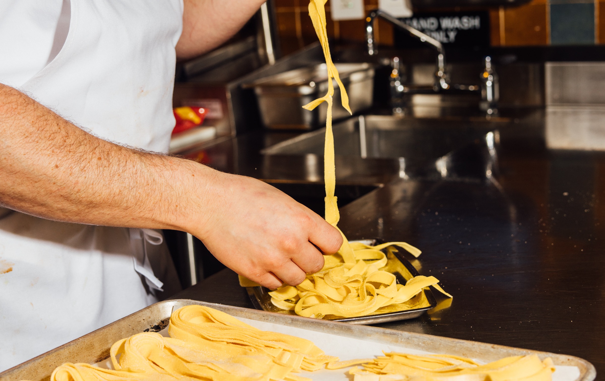 a man cutting food on a table