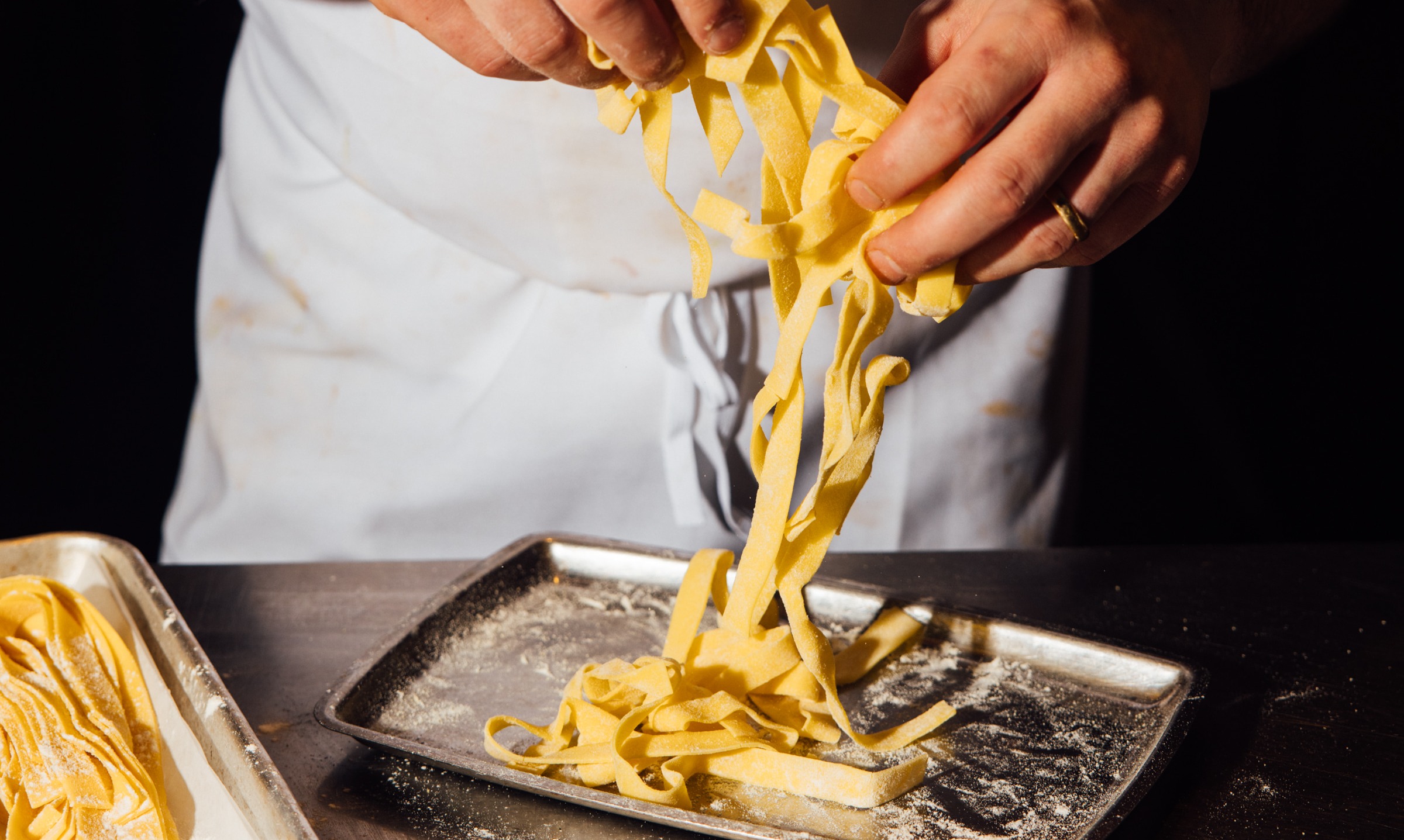a person cutting food on a table