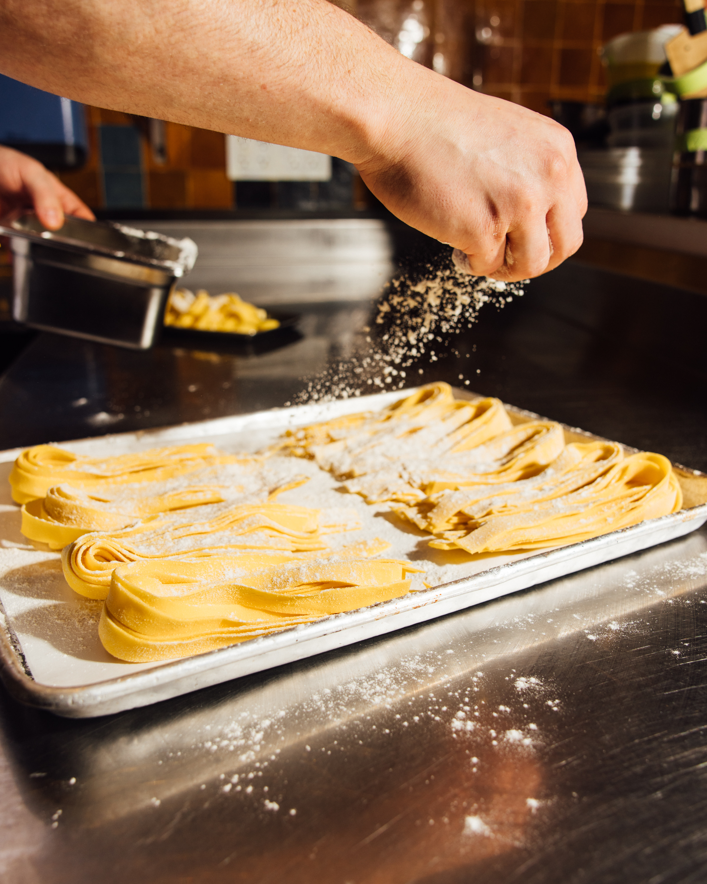 a person cutting food on a table