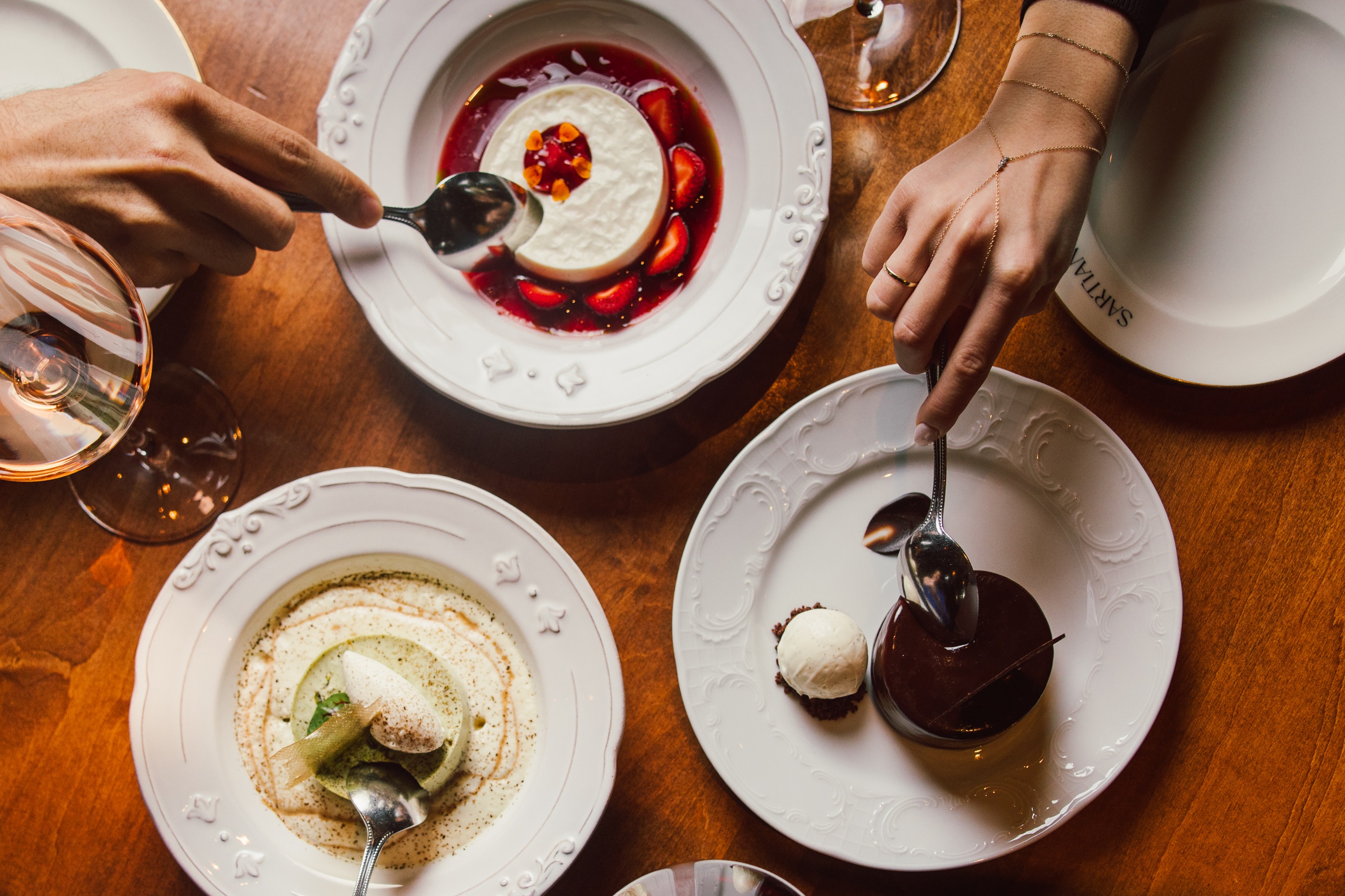 a person sitting at a table with a plate of food