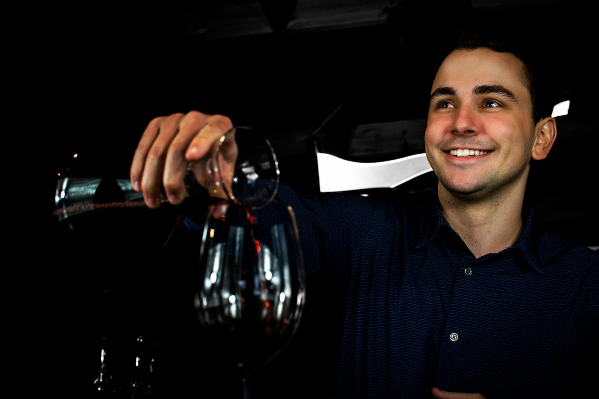 a man holding a glass of wine