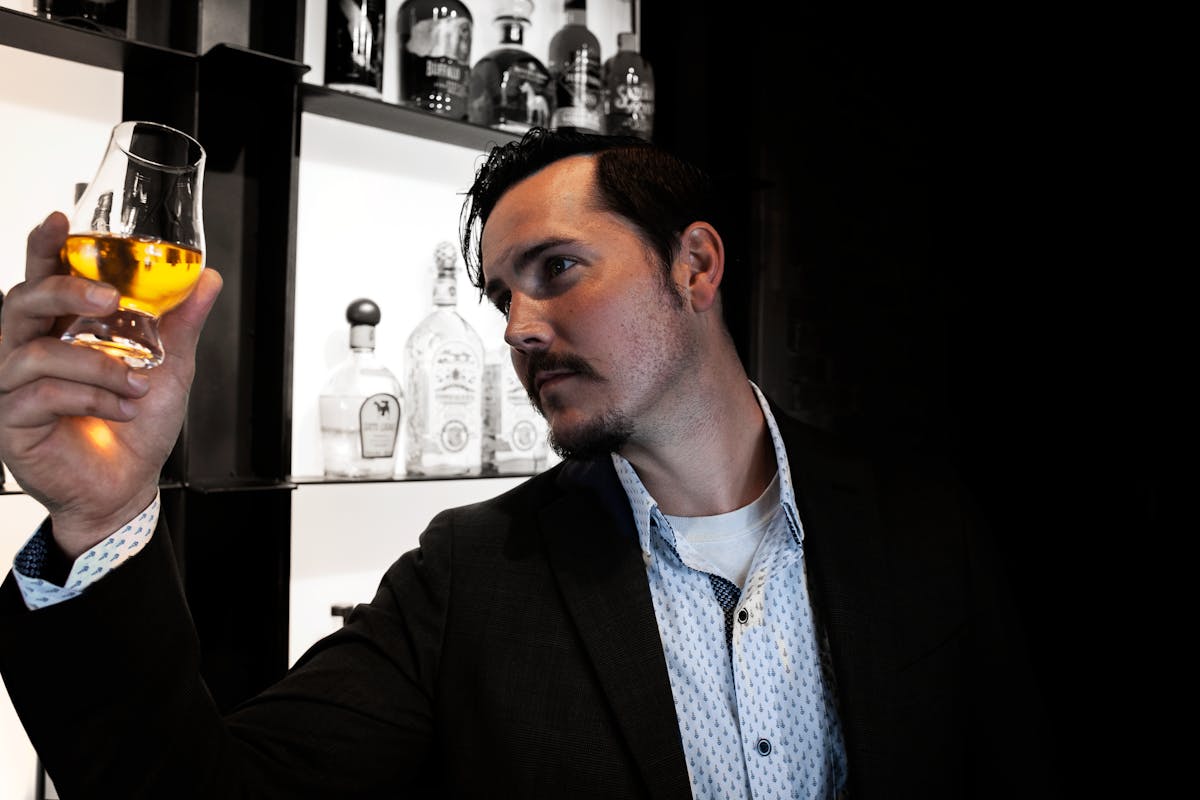 a man holding a glass of wine