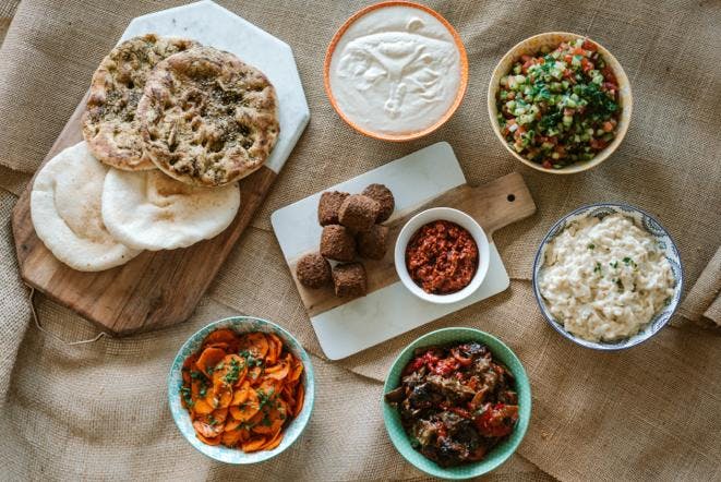 a bowl filled with different types of food on a table