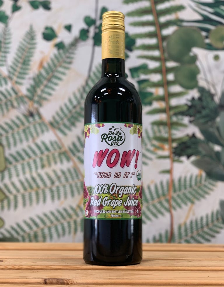 a close up of a bottle and a glass of wine