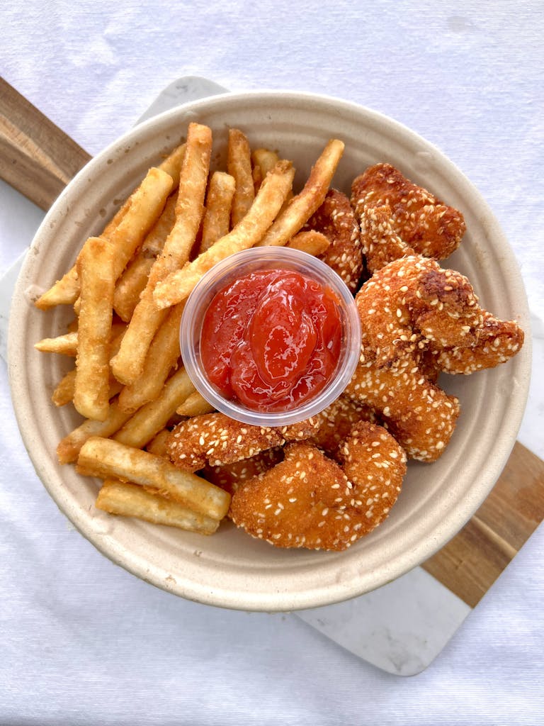a plate of food is sitting on the side of fries