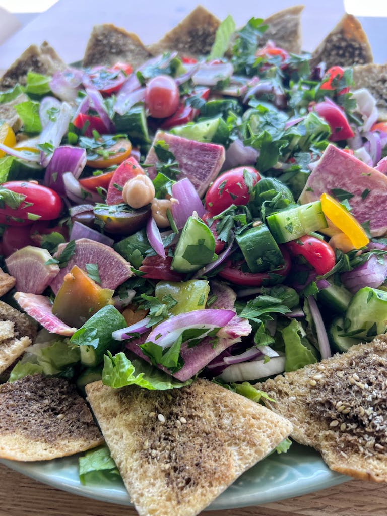 a plate of food with a sandwich and a salad