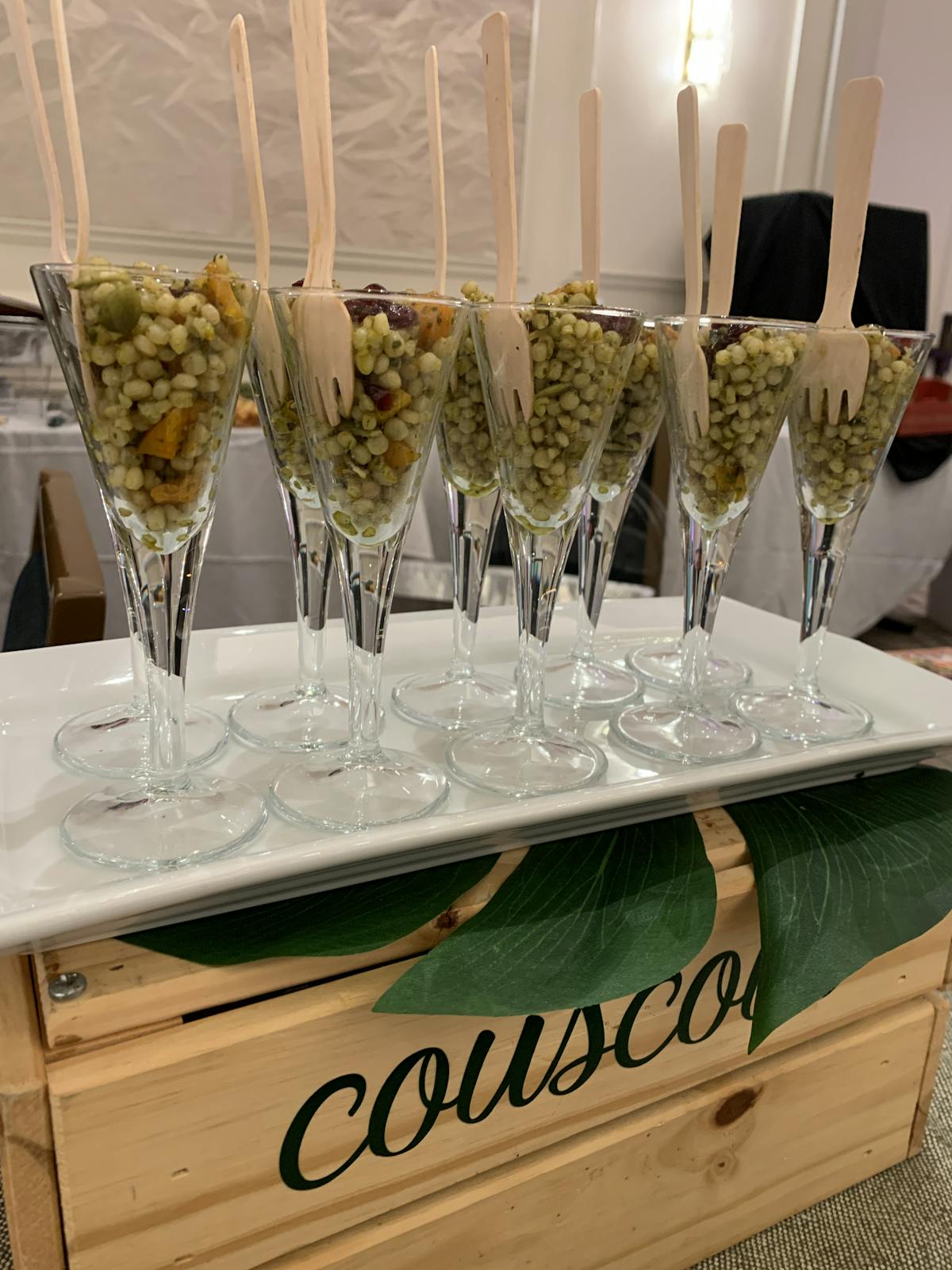 a row of wine glasses on a table