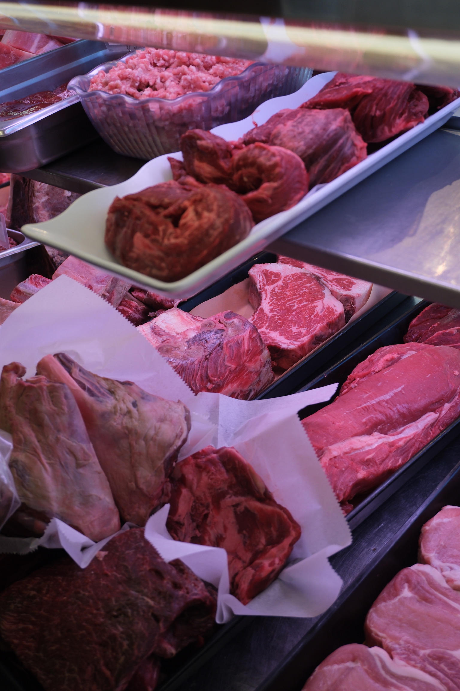 a trays of meat on a shelf