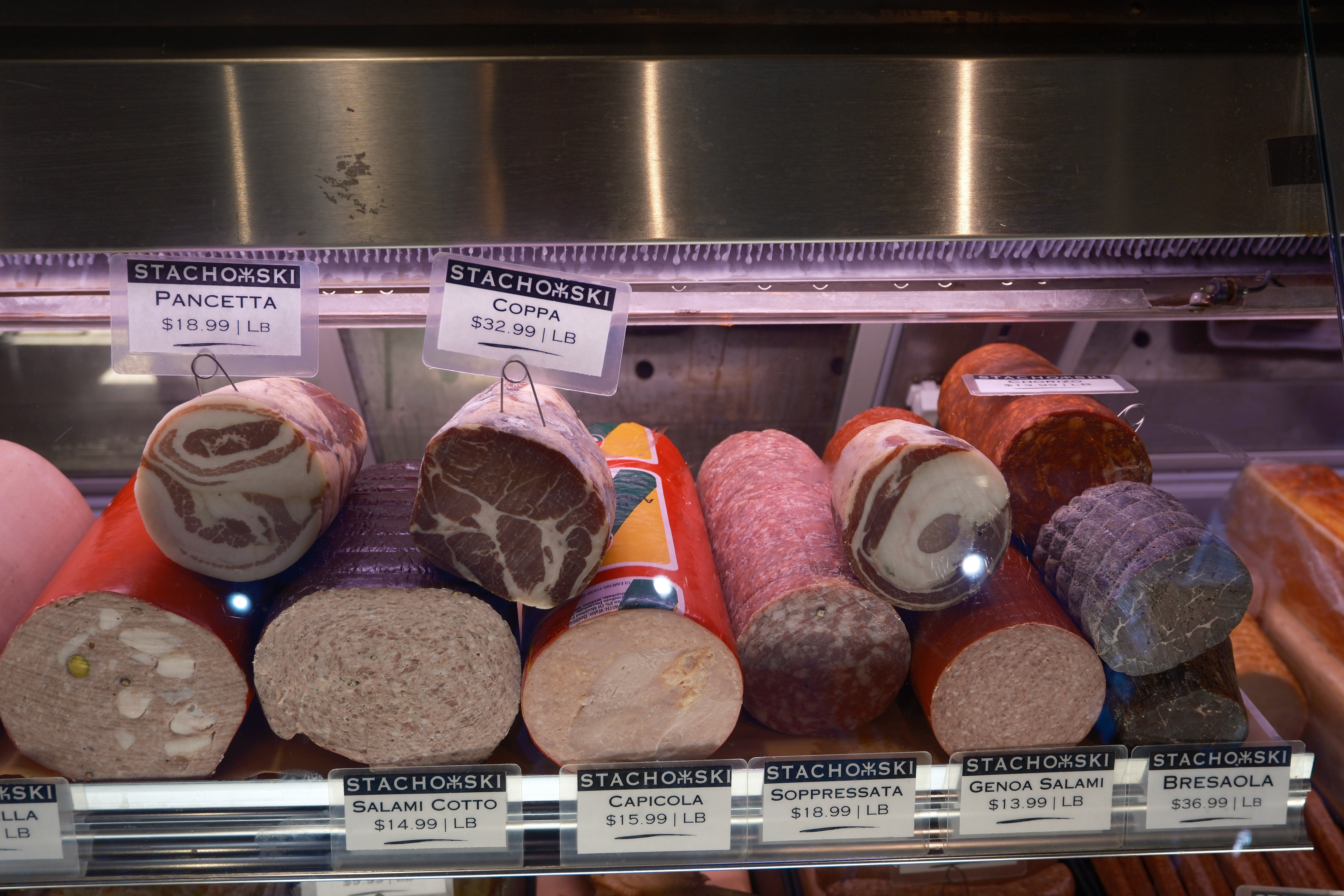 a display case with different types of meat