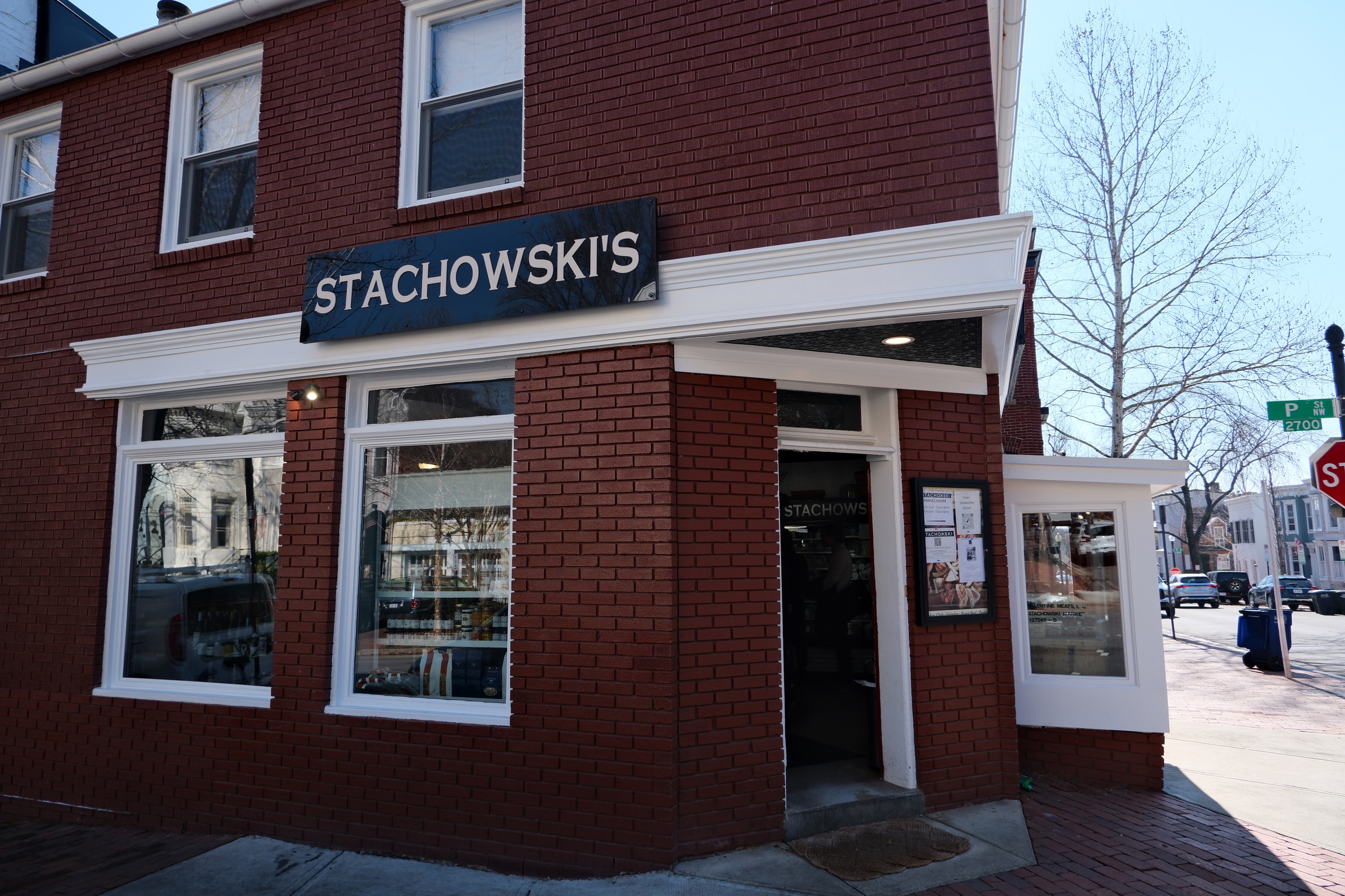 a brick building with a sign on the front