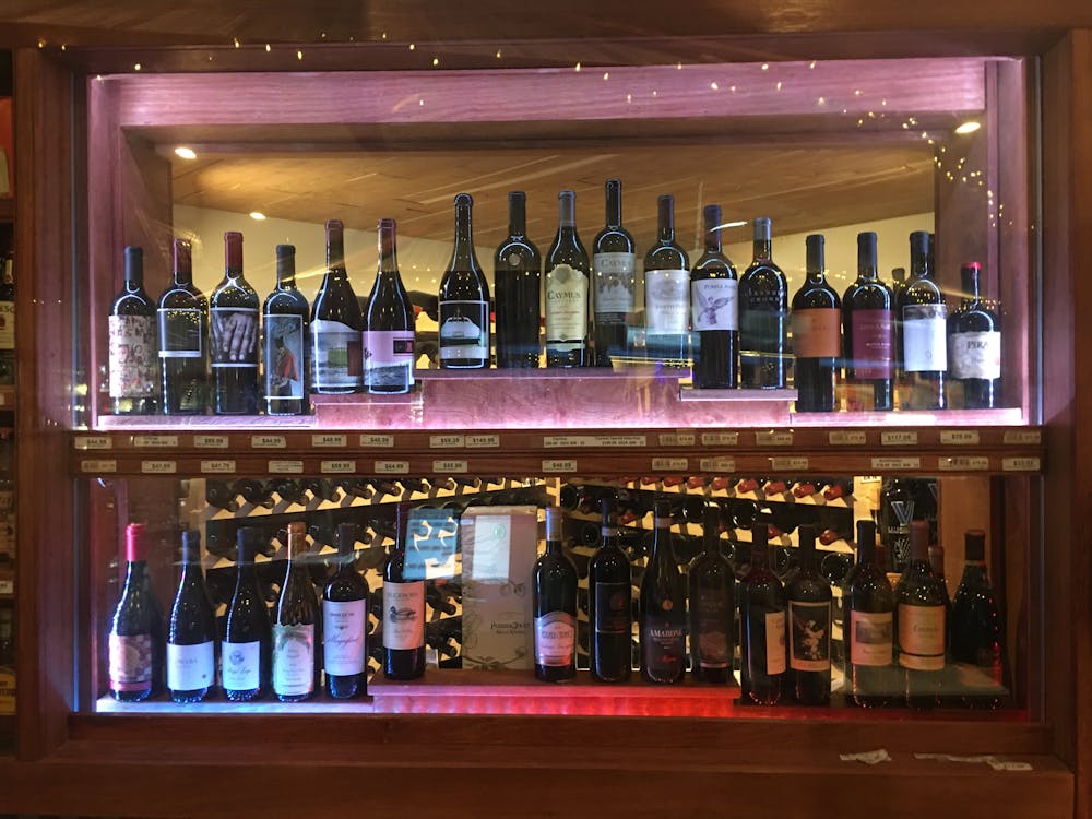a store shelf filled with wine glasses