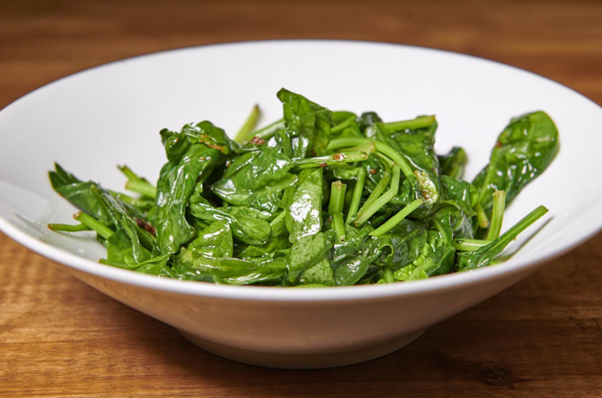 a bowl of food with broccoli