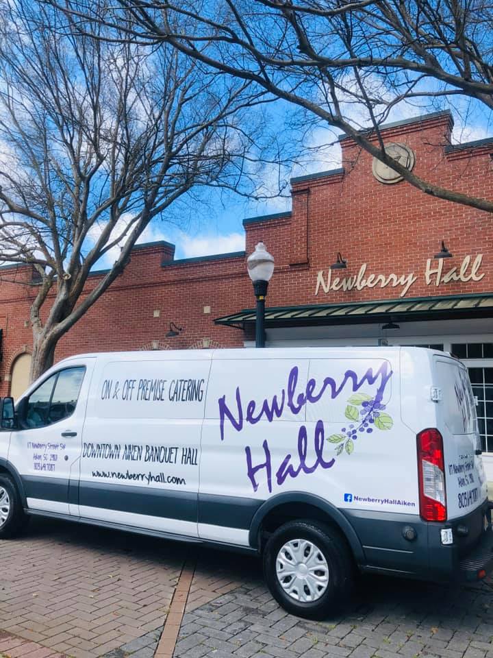 a van parked on the side of a building