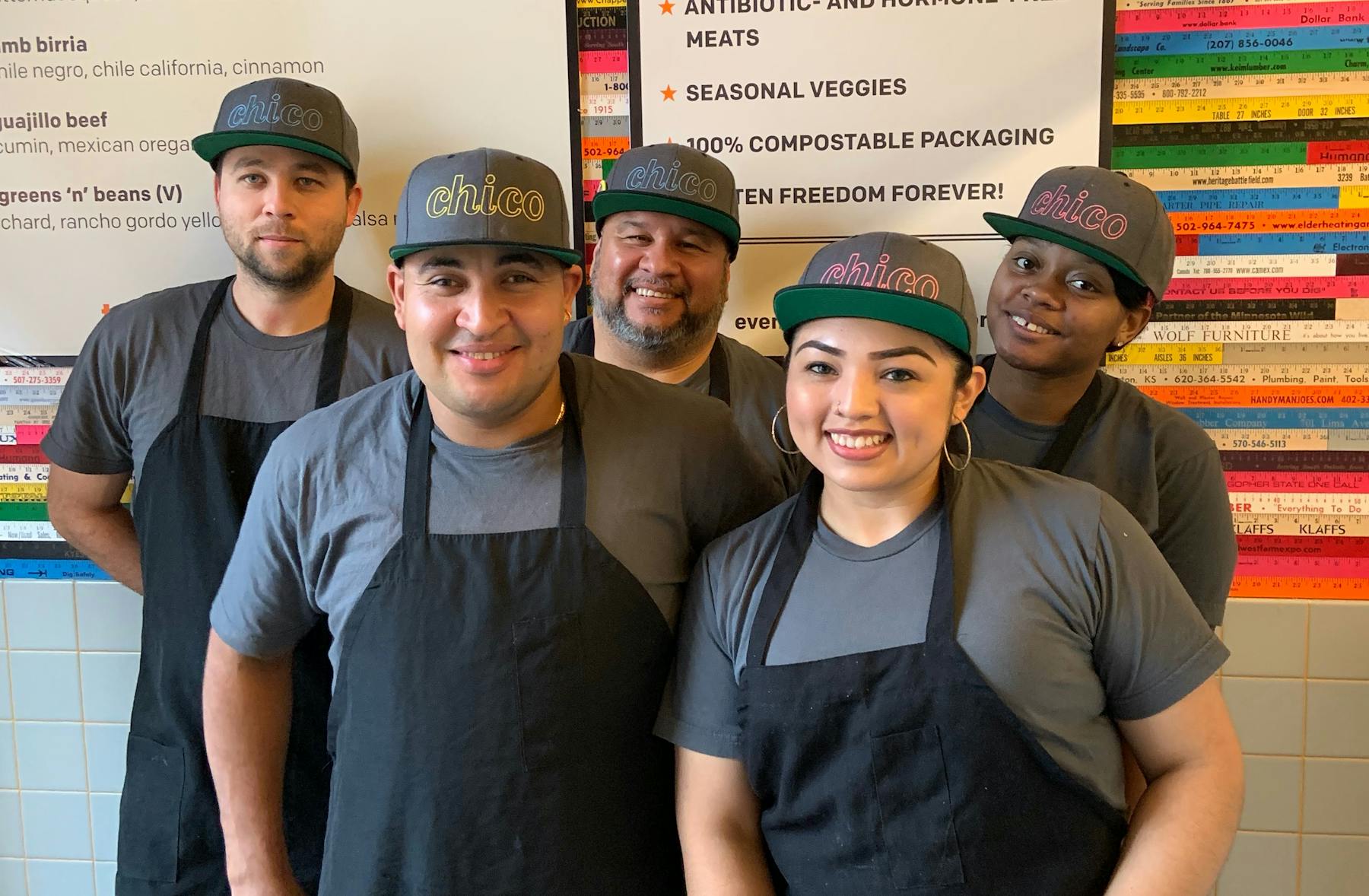 employees posing and smiling for the camera