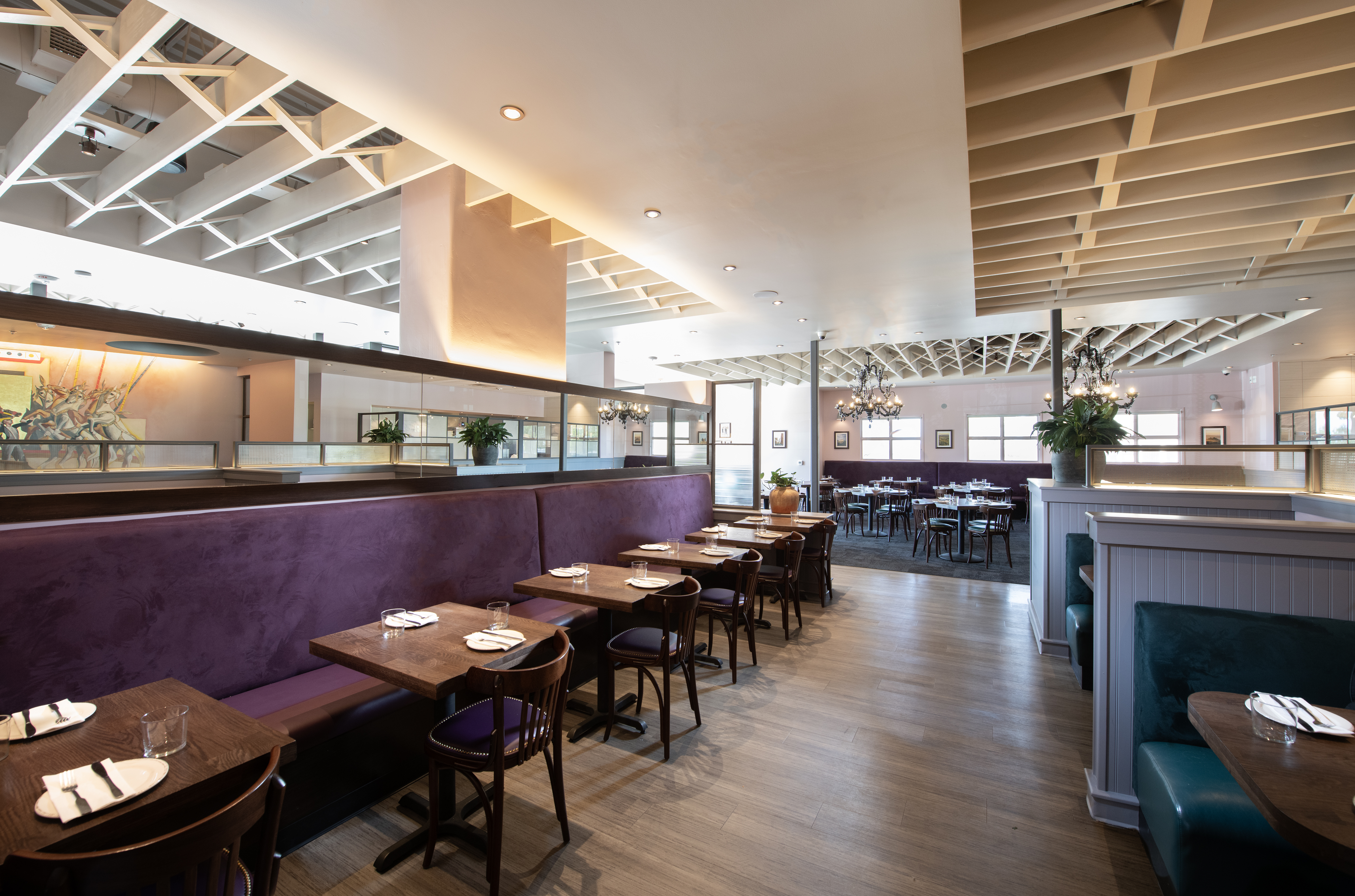 a room filled with furniture and a table in a restaurant