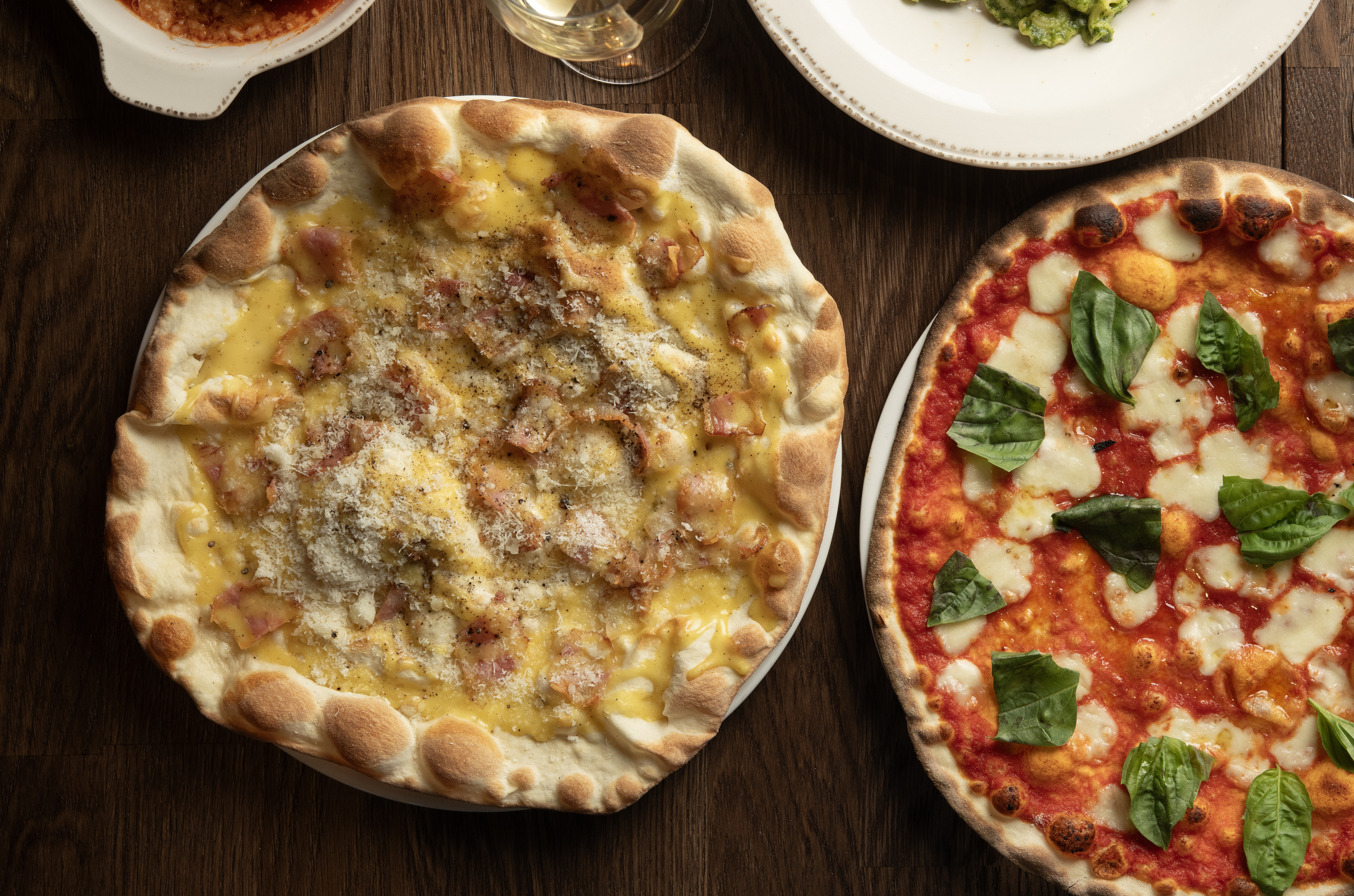 a pizza sitting on top of a wooden table
