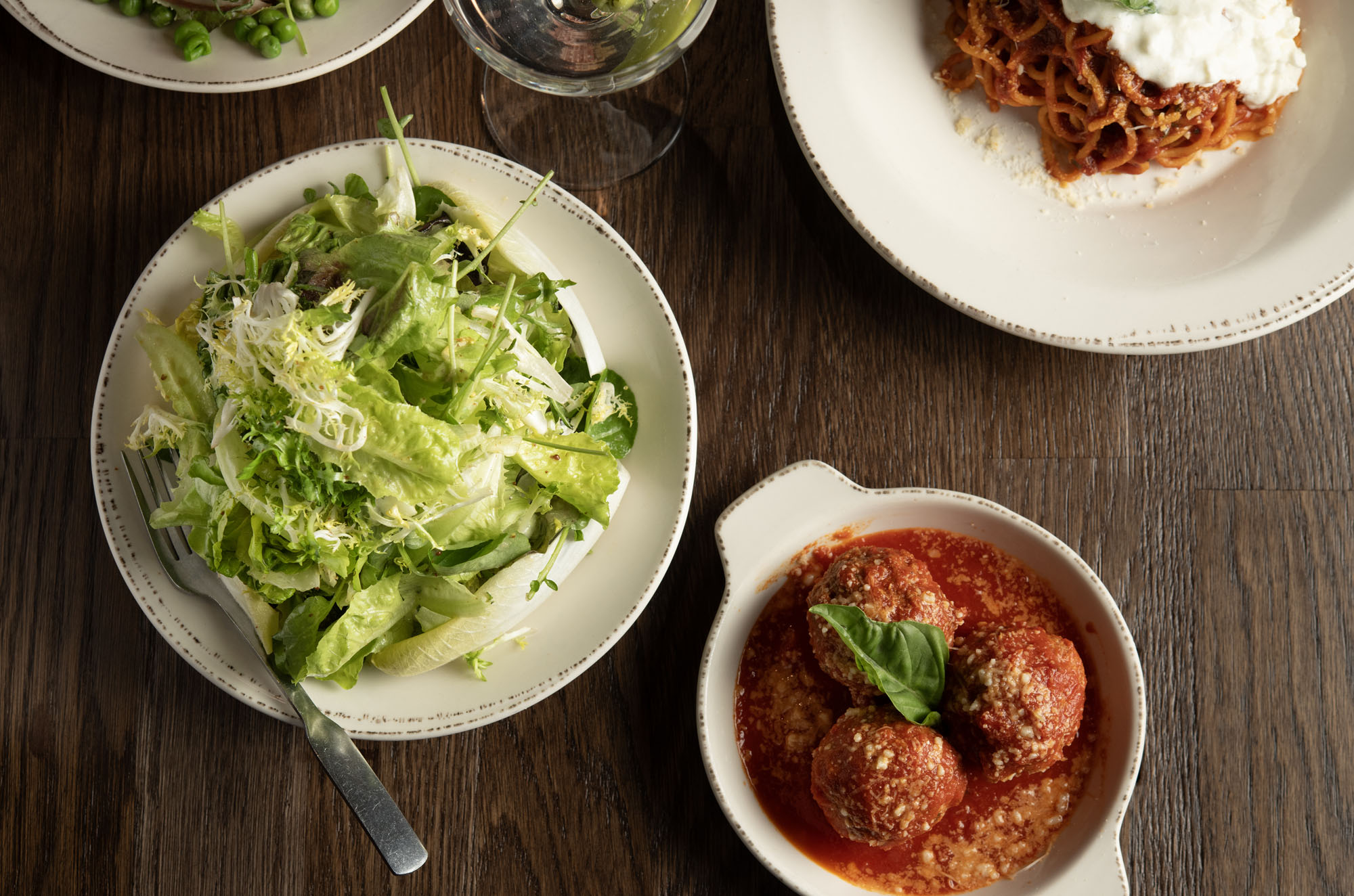 a bowl of food on a plate on a table