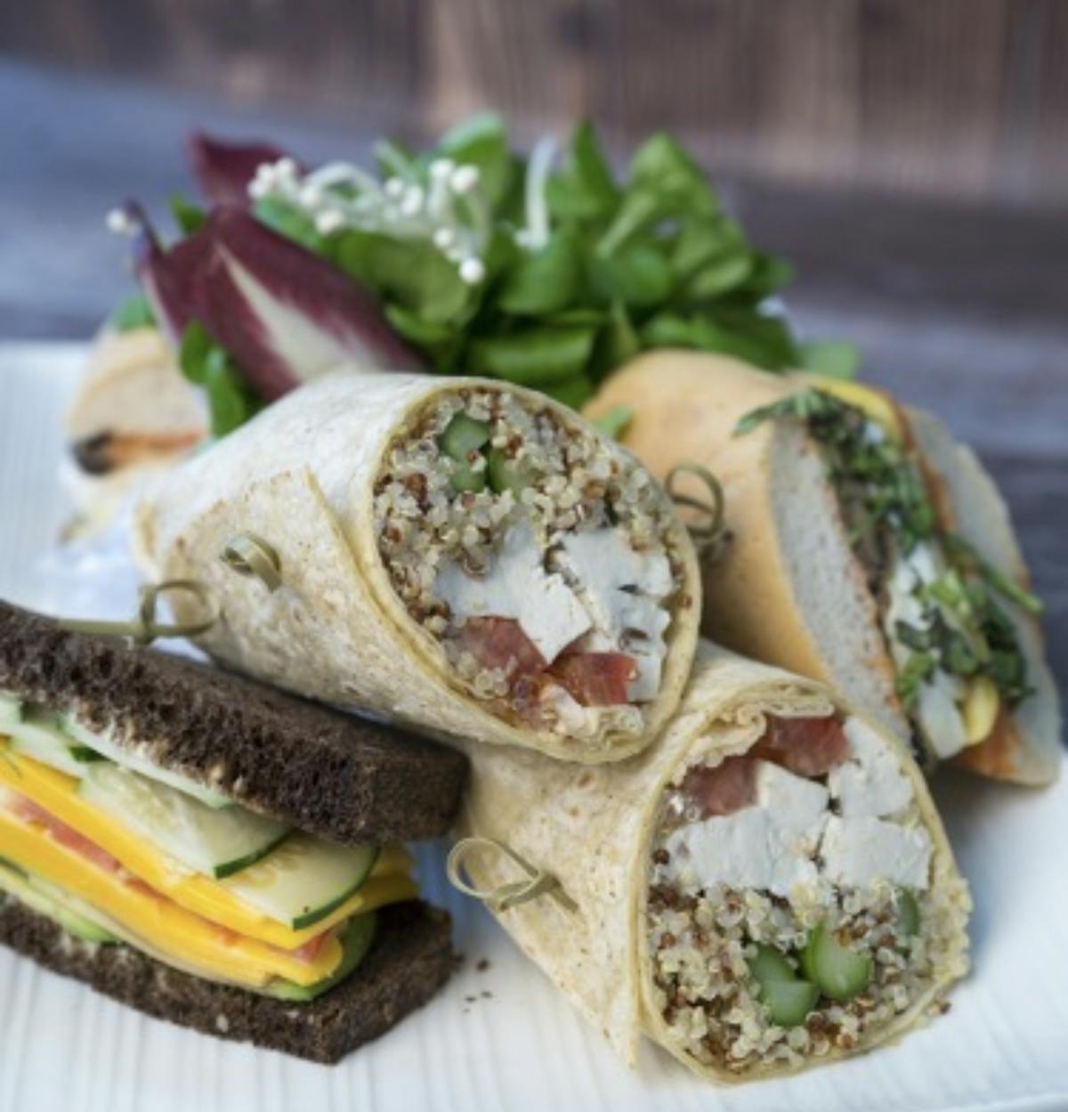 sandwiches and wraps on a plate
