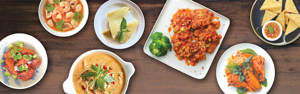 a plate is filled with different types of food on a table