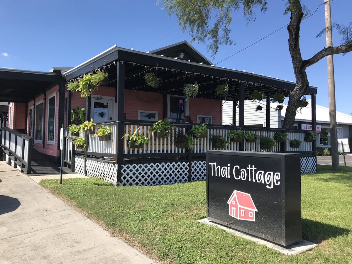 a sign in front of the restaurant