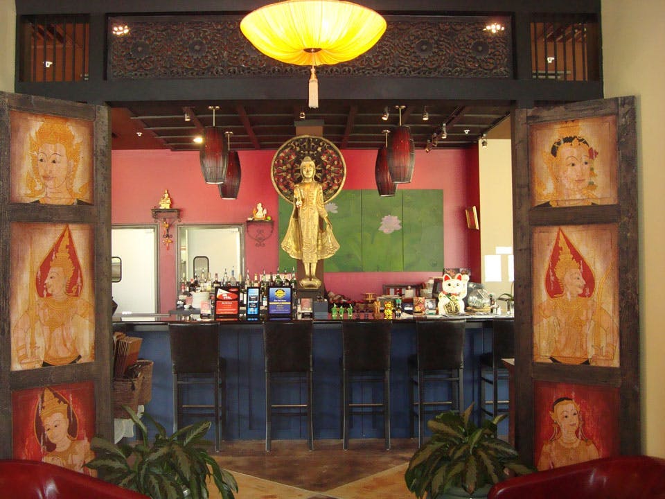 a room filled with furniture and a sculpture