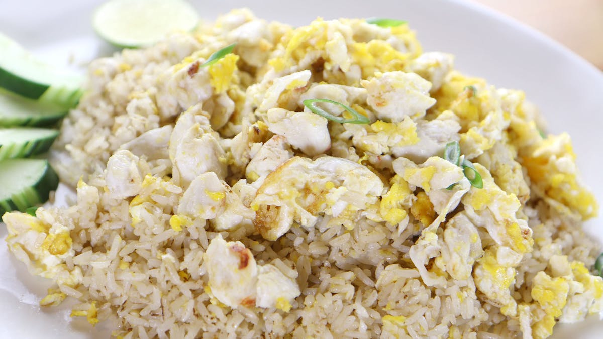 a close up of a plate of food with rice and vegetables
