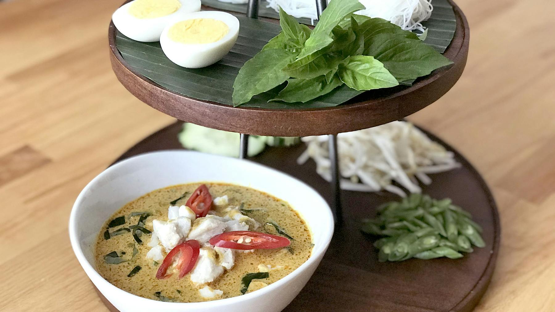 a bowl of food on a plate on a table