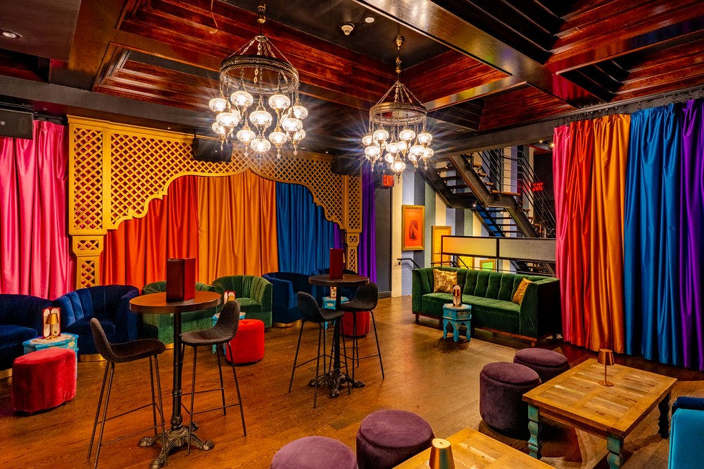 a room filled with furniture and a curtain