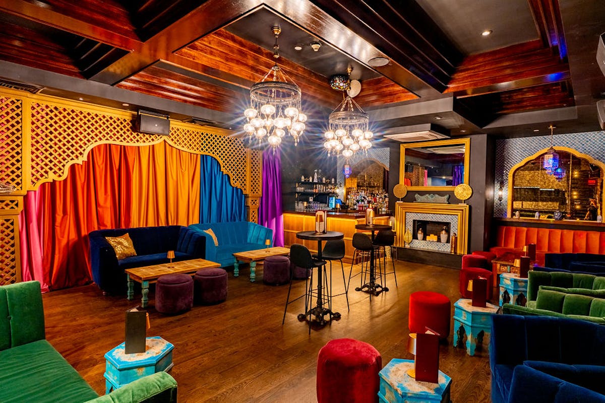 a room filled with furniture and a fireplace