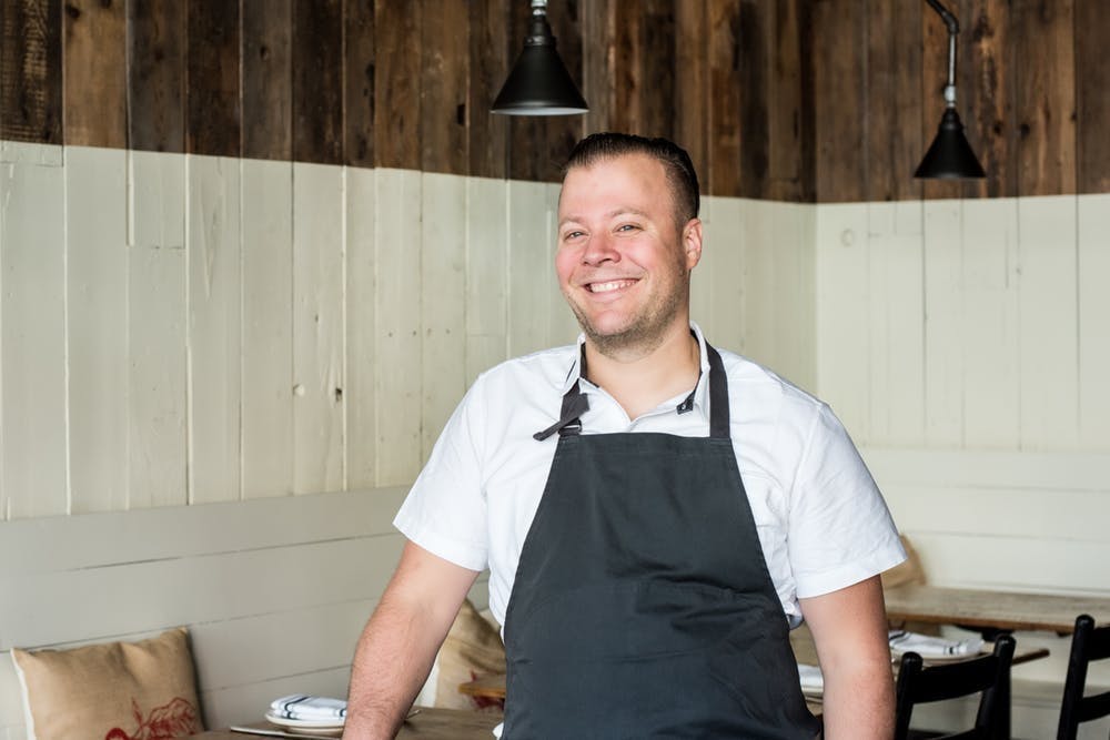 a man standing in a kitchen