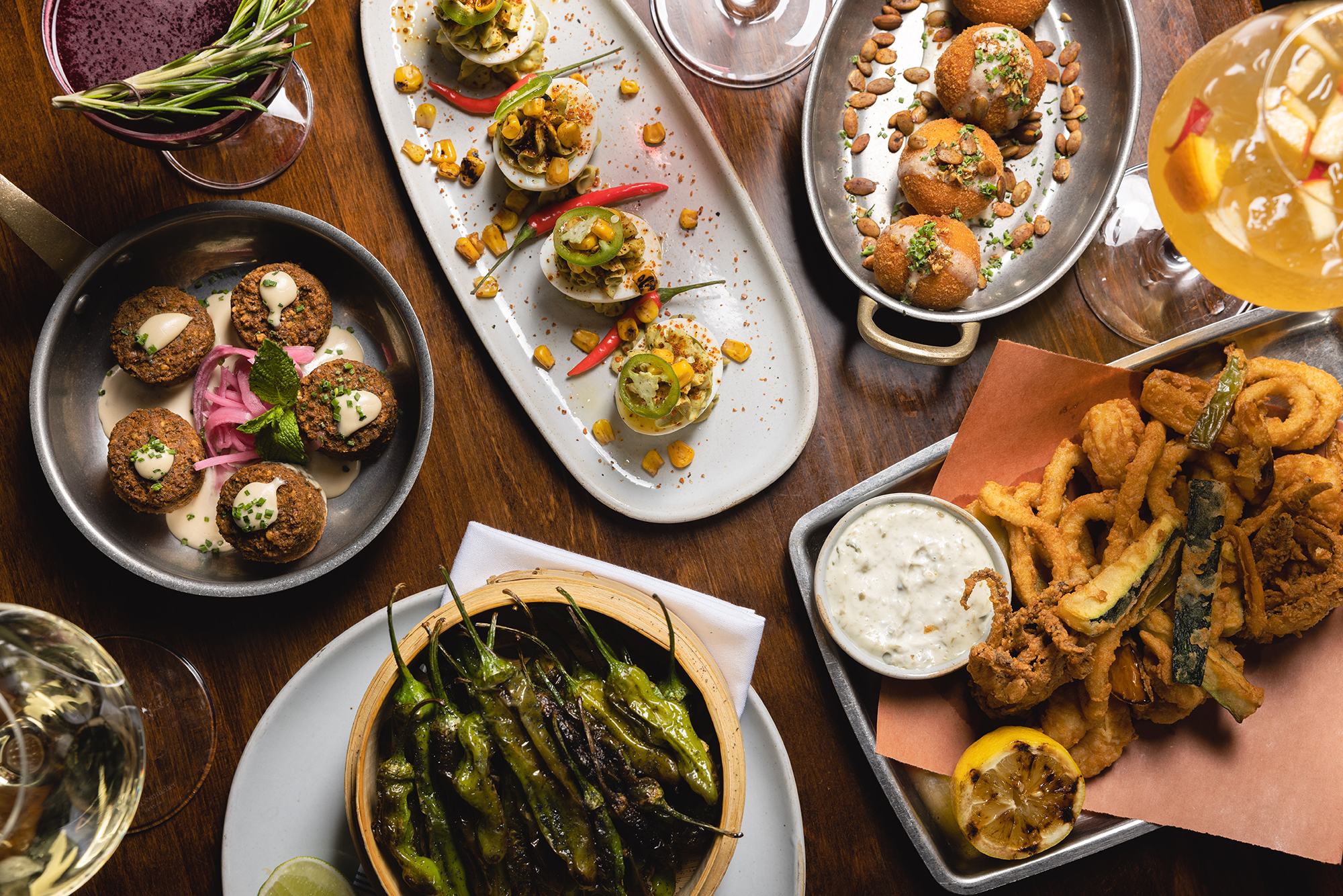 overhead shot of The Independent's shareables and side dishes located in Midtown, NYC
