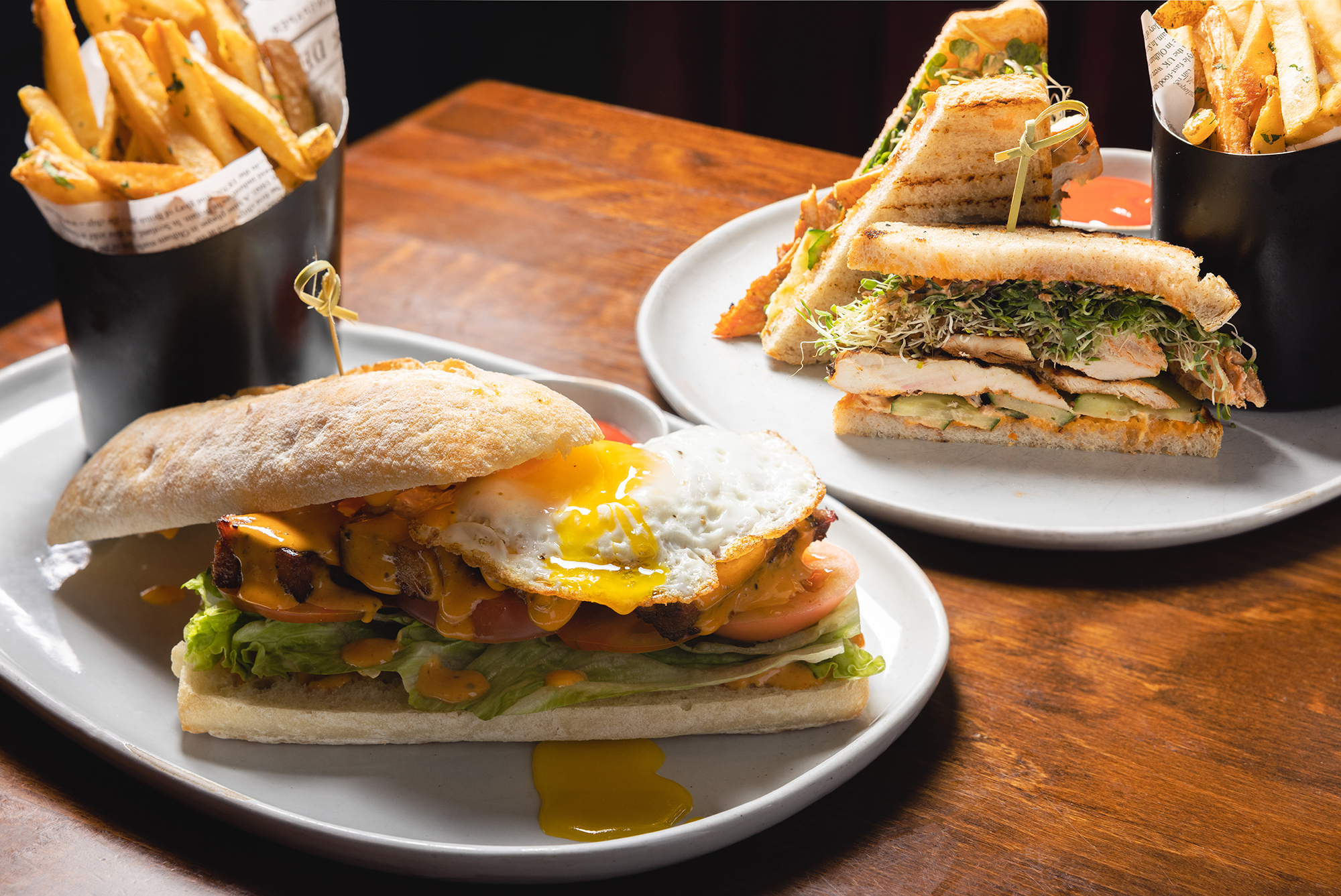 The Independent's Smoked Pork Belly BLT sandwich and Grilled Chicken Club by Times Square is perfect for lunch