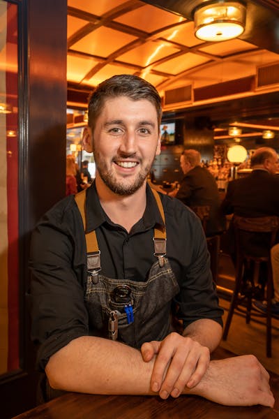 a man sitting at a table in a restaurant