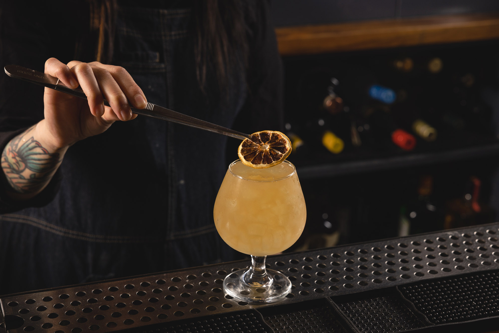 Bartender putting the finishing touch to The Independent's signature cocktail, Lord Lenox