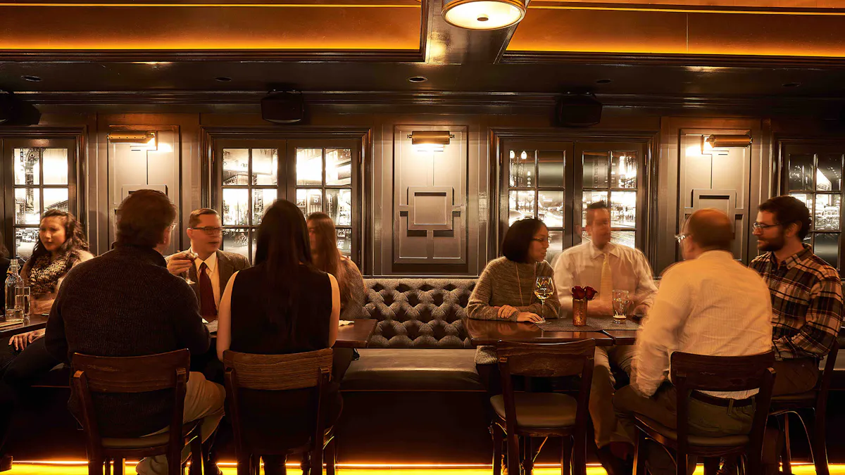 a group of people sitting at a table in front of a window