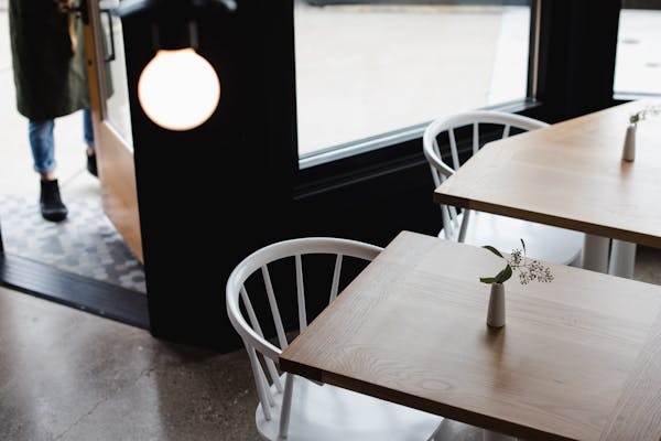 a dining room table in front of a window