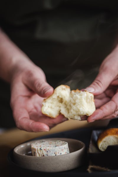 a hand holding a piece of food