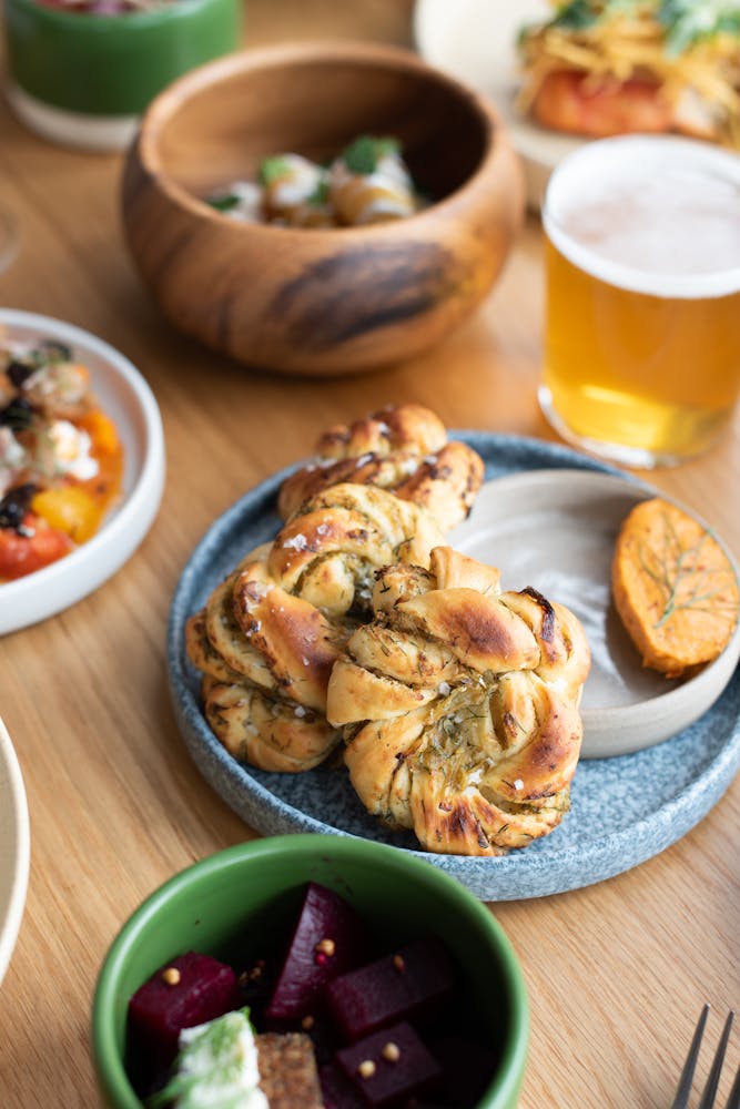 a plate of food sitting on top of a wooden table