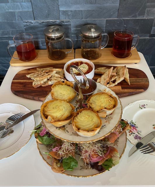 a table topped with plates of food on a plate