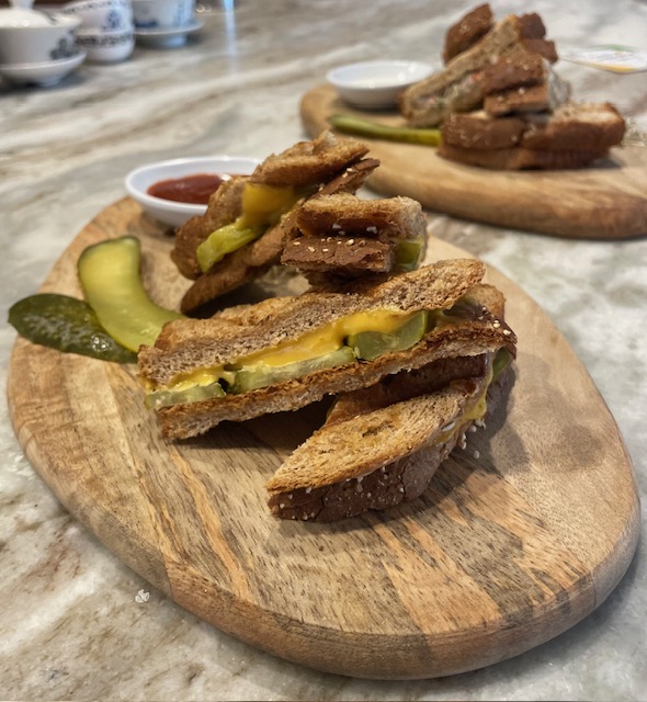 a sandwich sitting on top of a wooden table