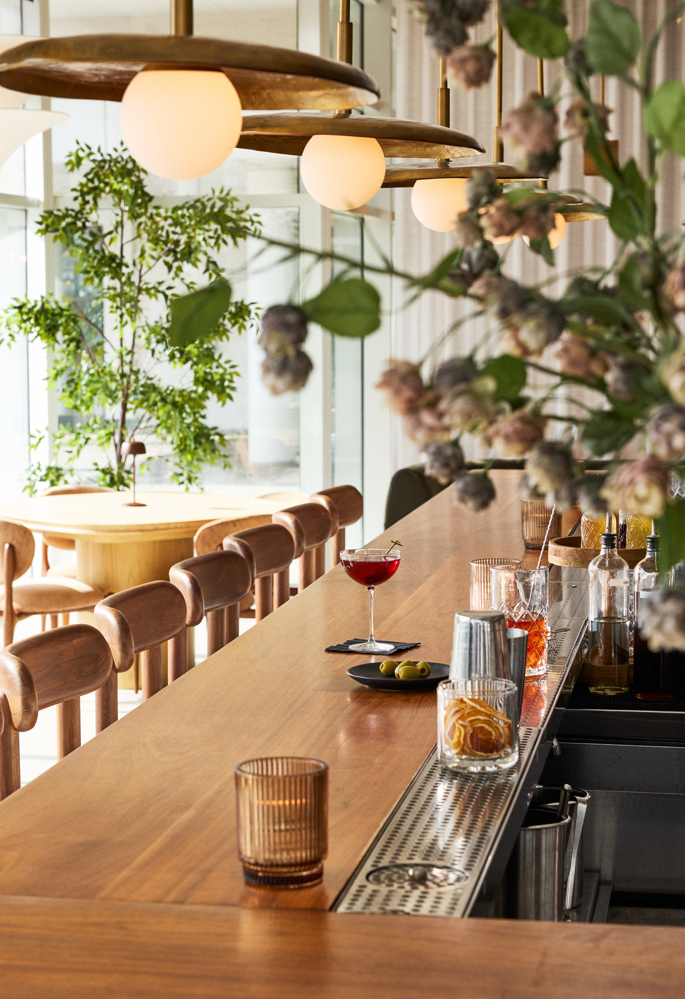 a long bar with a glass of liquid on it